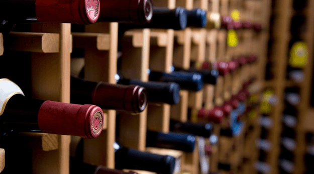 row of french wines in wine cellar